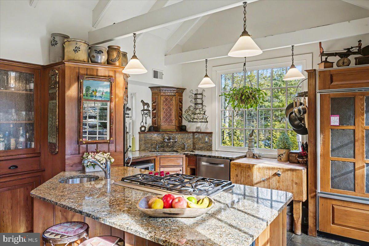 6338 Old Carversville Road Carversville, PA 18913 - Photo 29 of 56 a dining room with furniture a chandelier and wooden floor