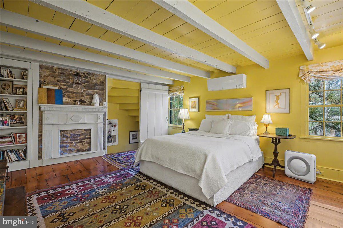 6338 Old Carversville Road Carversville, PA 18913 - Photo 37 of 56 a bedroom with a bed and a fireplace