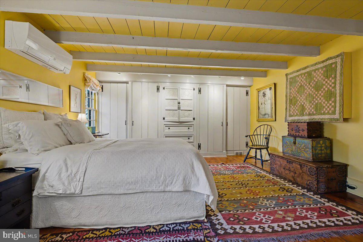 6338 Old Carversville Road Carversville, PA 18913 - Photo 38 of 56 a bedroom with a bed a table and chair