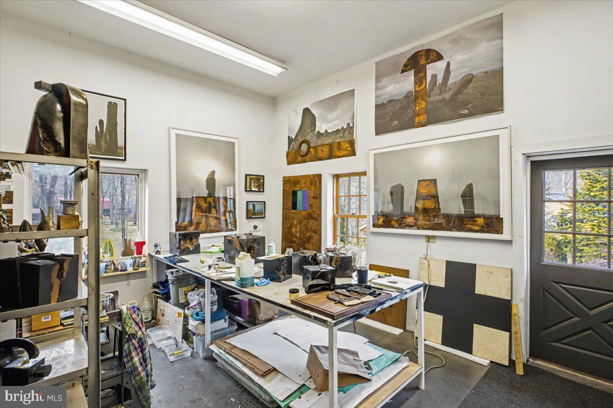 6338 Old Carversville Road Carversville, PA 18913 - Photo 45 of 56 a living room with furniture a flat screen tv and a table