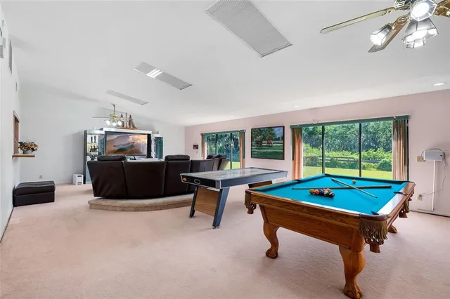 a room with furniture and pool table