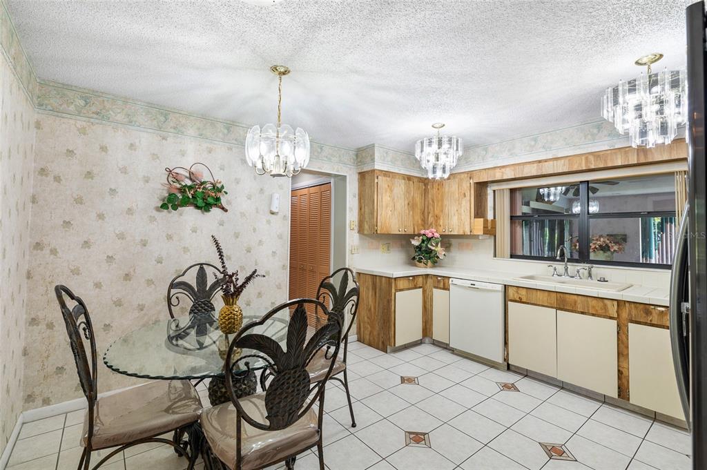 34 Misty Meadow Lane Mulberry, FL 33860 - Photo 20 of 49 a dining room with furniture a chandelier and window