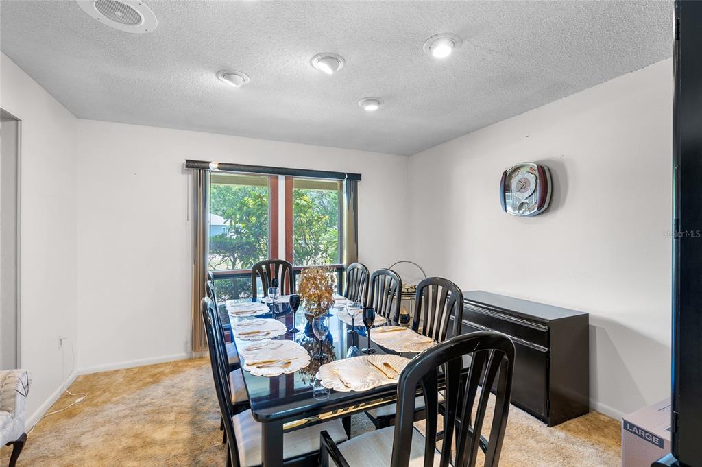 34 Misty Meadow Lane Mulberry, FL 33860 - Photo 24 of 49 a view of a dining room with furniture and a window