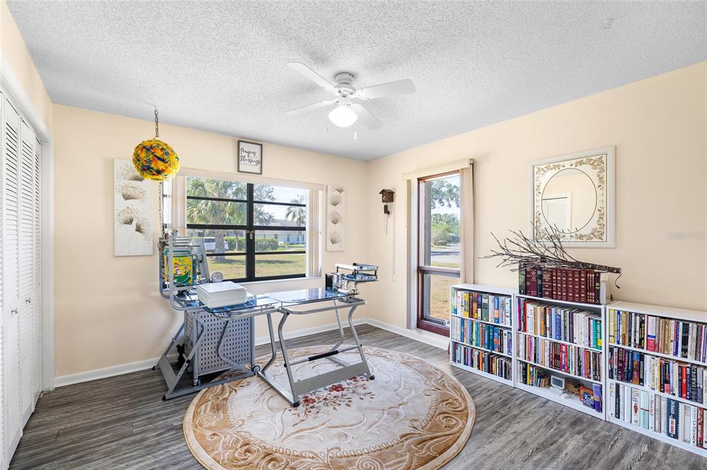 34 Misty Meadow Lane Mulberry, FL 33860 - Photo 28 of 49 a workspace with furniture window and wooden floor