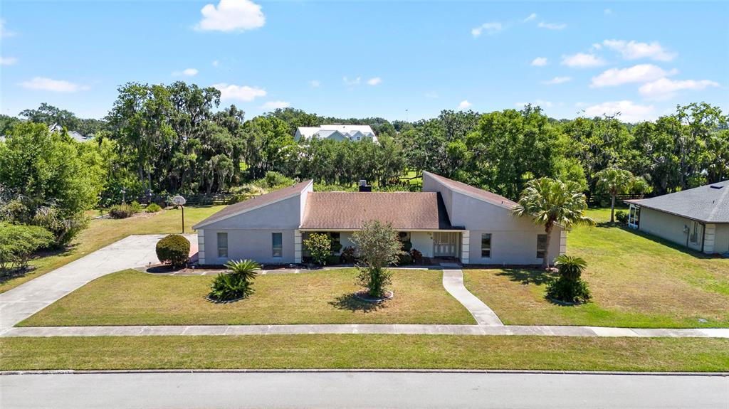 34 Misty Meadow Lane Mulberry, FL 33860 - Photo 3 of 49 a view of a house with a yard