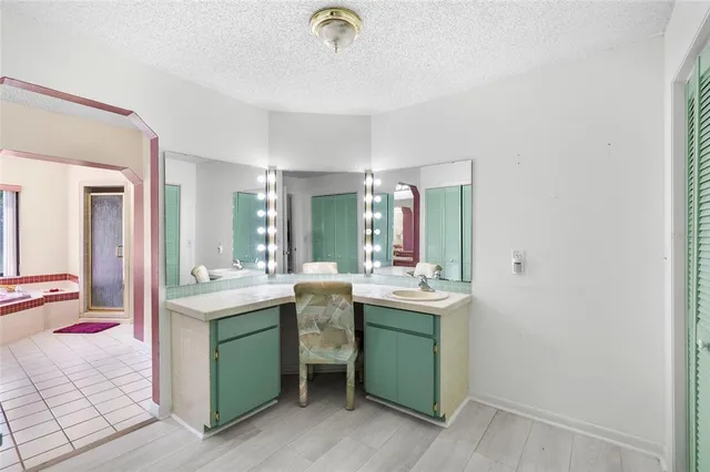 a kitchen with a sink and cabinets