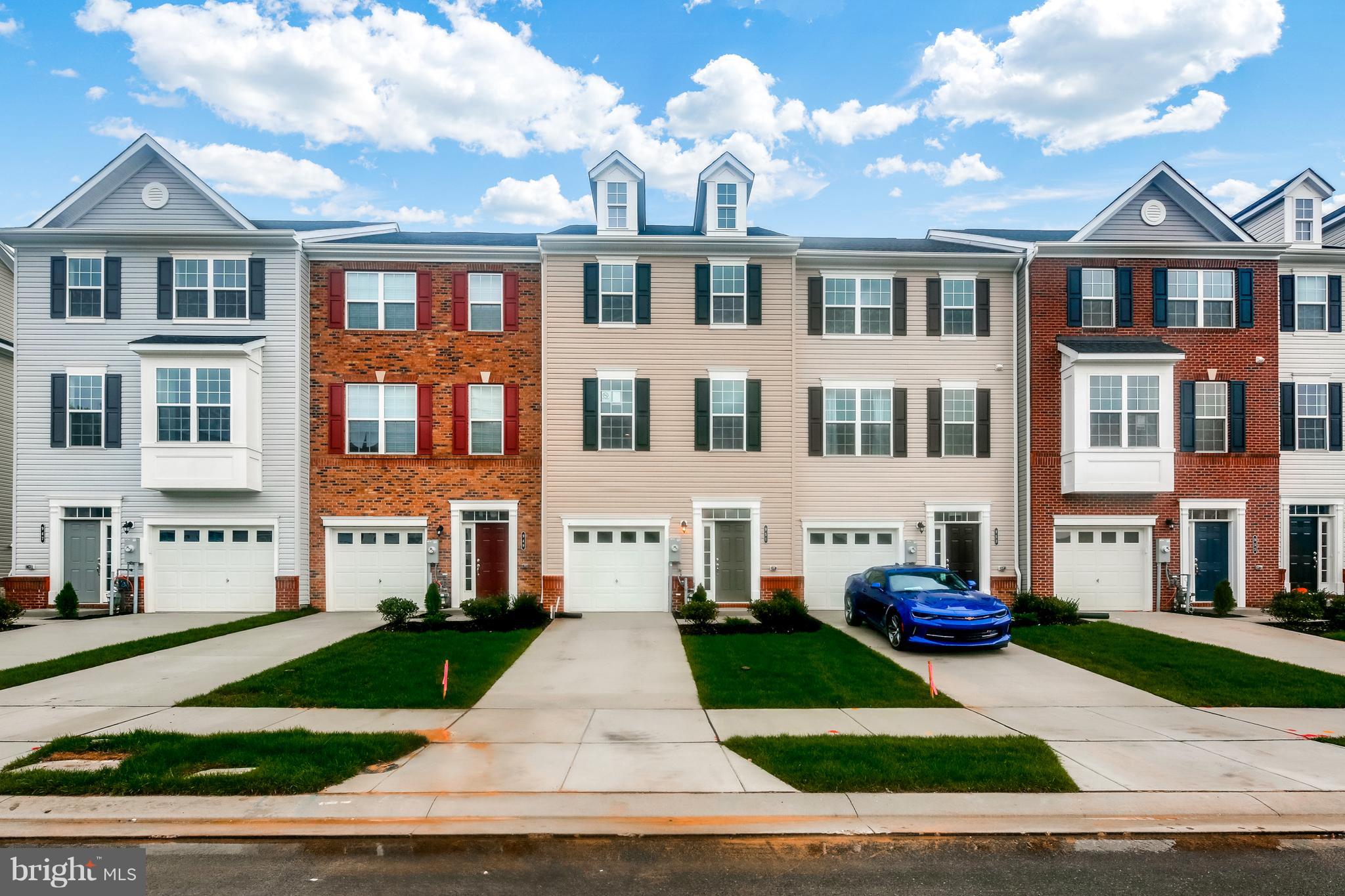 951 Morgan Run Road Middle River, MD 21220 - Photo 1 of 12 a front view of a residential apartment building with a yard and plants