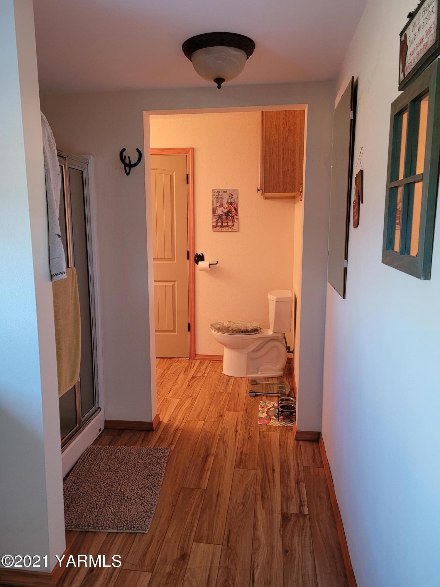 7773 North Wenas Road Selah, WA 98942 - Photo 20 of 45 a view of a bathroom with a sink and a toilet