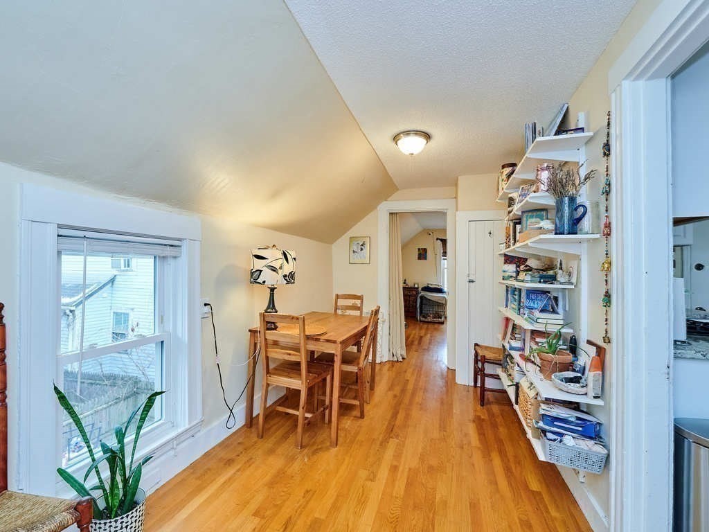 34 R Clyde Street Somerville, MA 02145 - Photo 21 of 31 a dining room with furniture and wooden floor