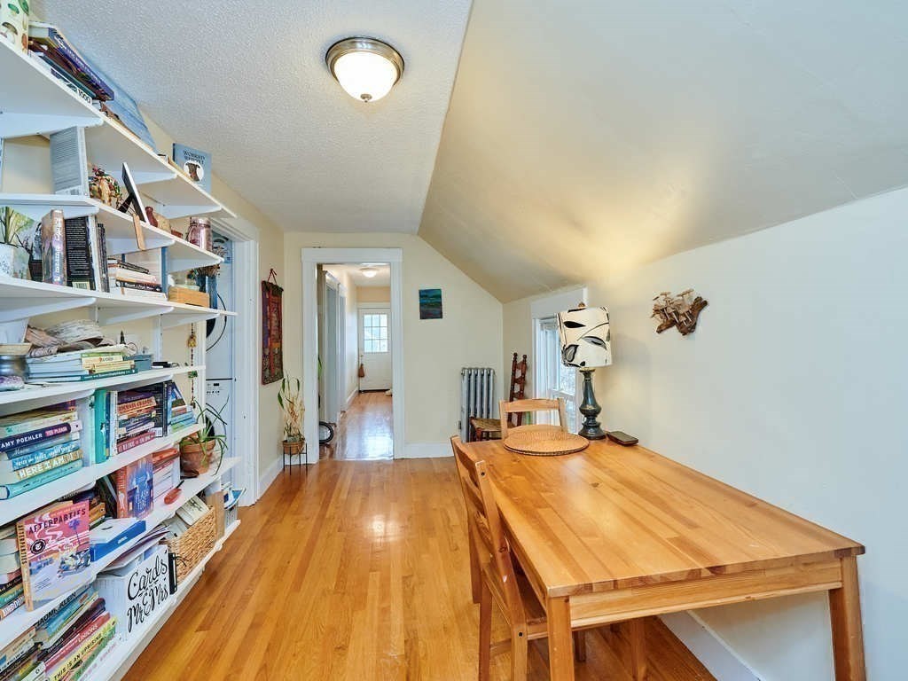 34 R Clyde Street Somerville, MA 02145 - Photo 22 of 31 a room with lots of furniture and wooden floor