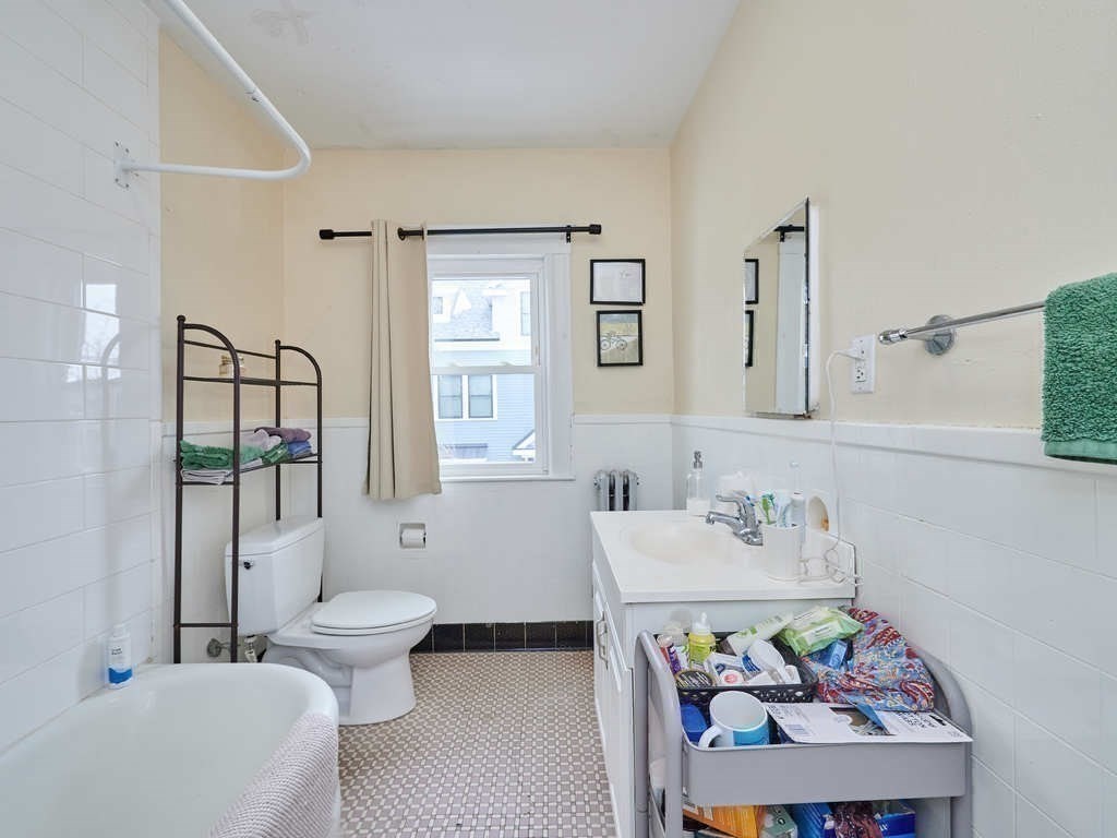 34 R Clyde Street Somerville, MA 02145 - Photo 24 of 31 a bathroom with a sink toilet and shower