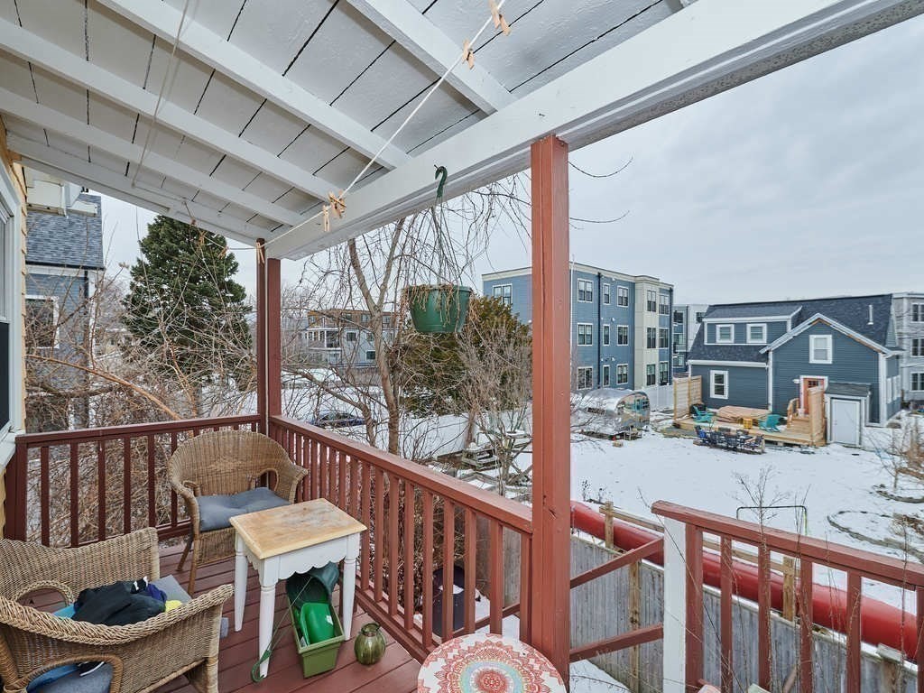 34 R Clyde Street Somerville, MA 02145 - Photo 25 of 31 a balcony with wooden floor and furniture