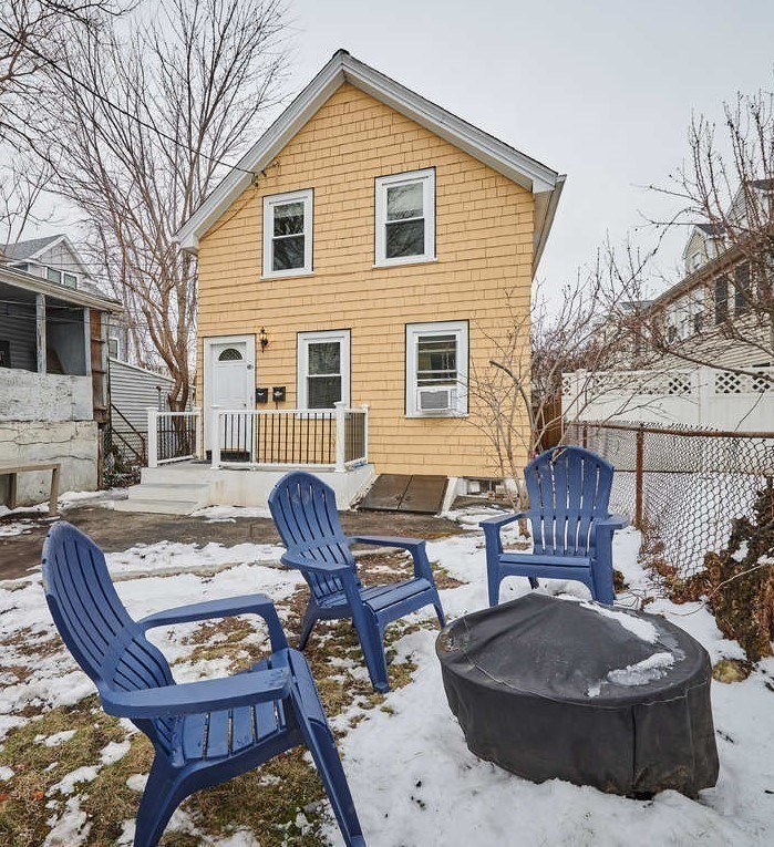 34 R Clyde Street Somerville, MA 02145 - Photo 3 of 31 a view of a patio with couches chairs and a fire pit