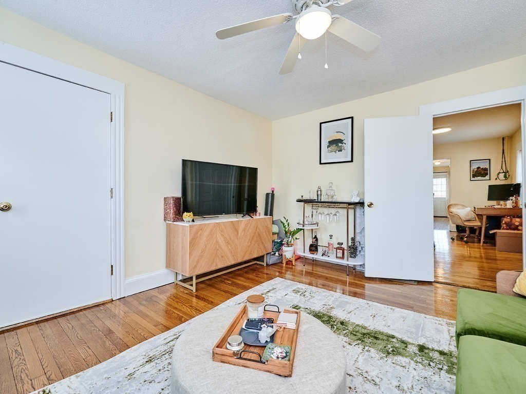 34 R Clyde Street Somerville, MA 02145 - Photo 6 of 31 a living room with furniture and a flat screen tv
