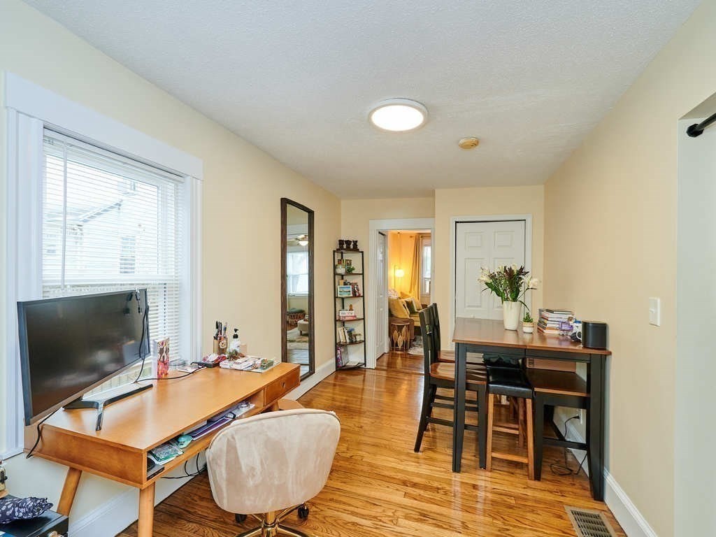 34 R Clyde Street Somerville, MA 02145 - Photo 8 of 31 a living room with furniture and a flat screen tv