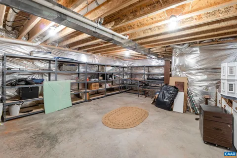 a view of garage with cars