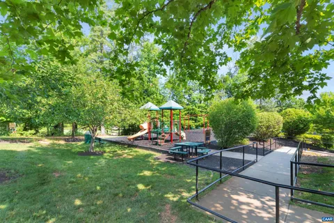 a view of a backyard with sitting area