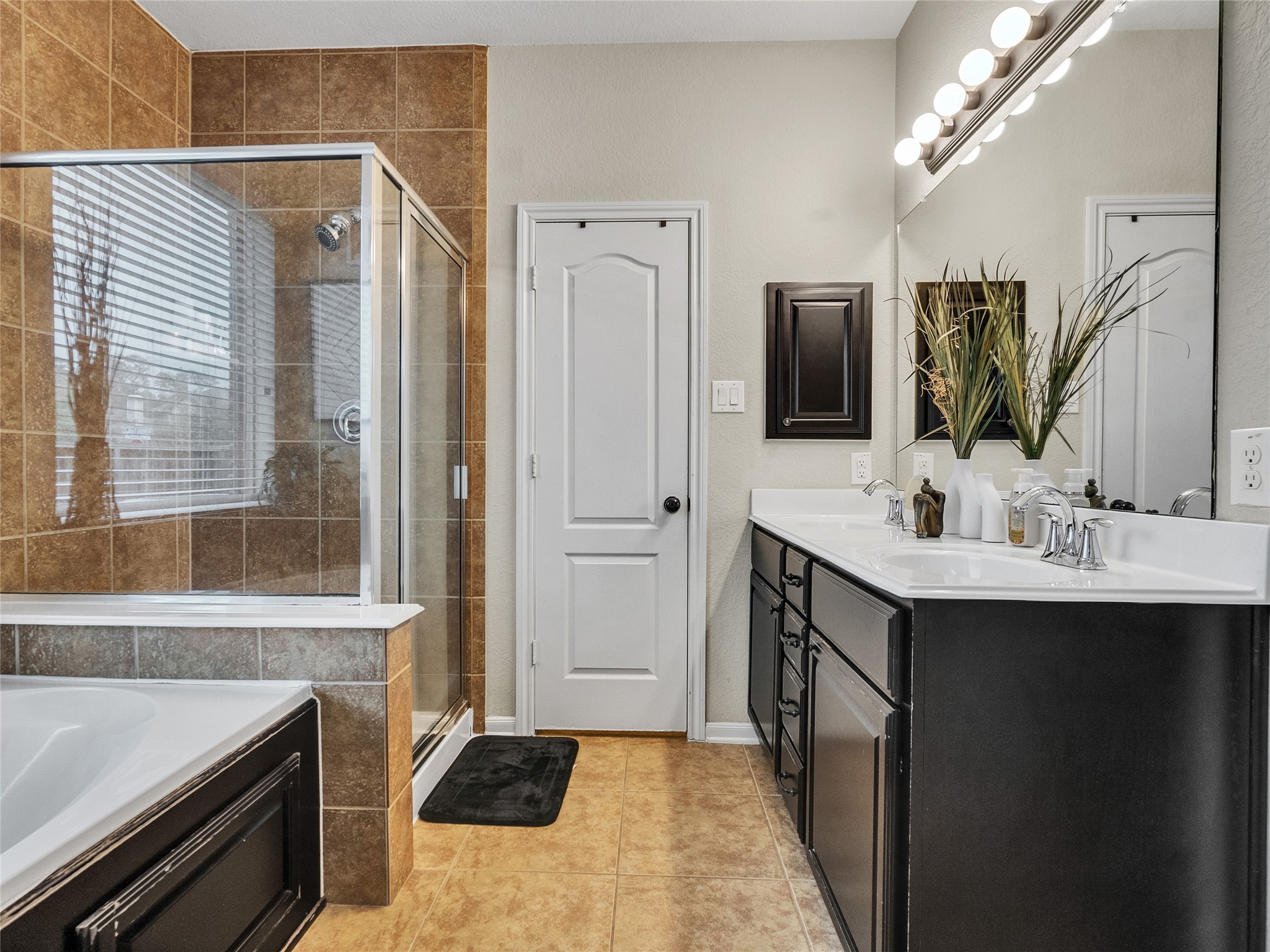 6530 Hunters Creek Lane Baytown, TX 77521 - Photo 19 of 40 a bathroom with a sink a double vanity and a mirror