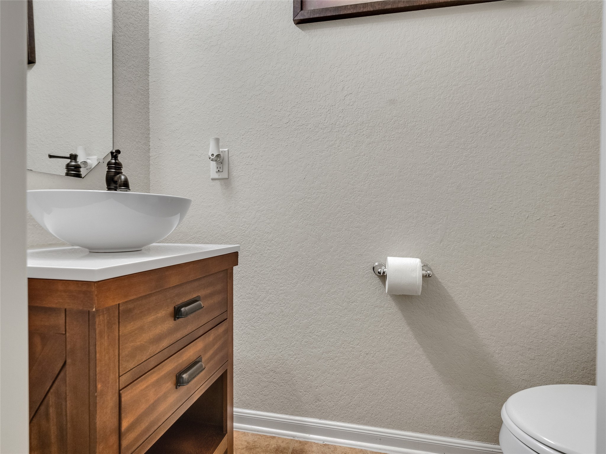 6530 Hunters Creek Lane Baytown, TX 77521 - Photo 31 of 40 a bathroom with a sink a toilet and a mirror