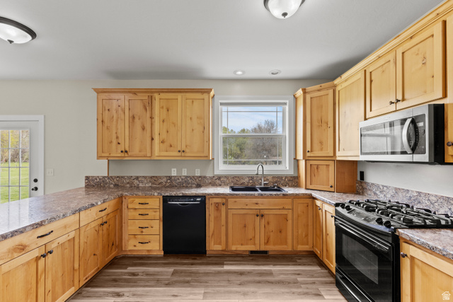 75 East 200 North Mendon, UT 84325 - Photo 10 of 36 Kitchen featuring light wood finish cabinets, black appliances, light wood-style flooring, a peninsula, and recessed lighting