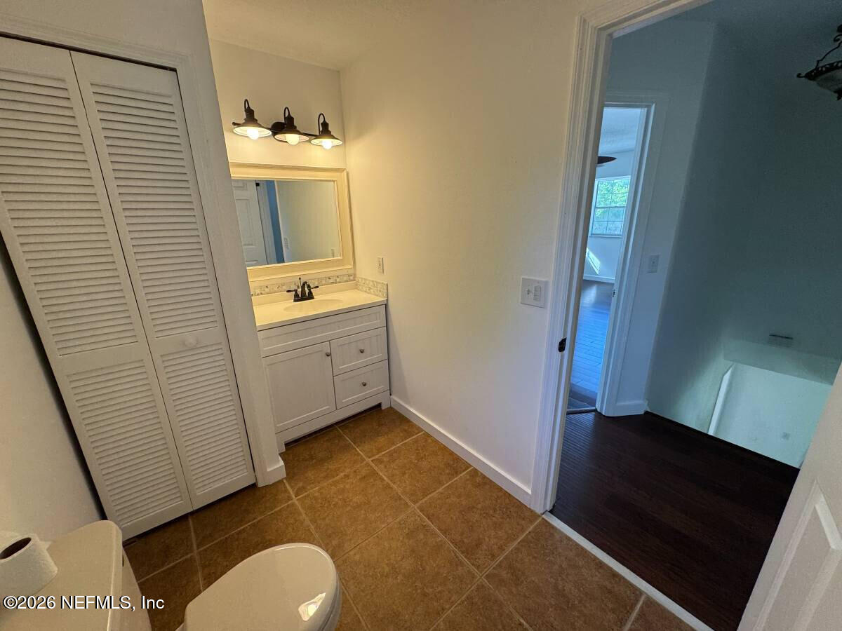 543 Ray Edwards Road St. Augustine, FL 32086 - Photo 17 of 19 a bathroom with a sink toilet and mirror