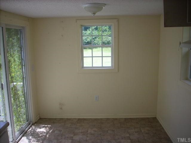 1108 Bethel Road Raleigh, NC 27610 - Photo 3 of 4 an empty room with windows