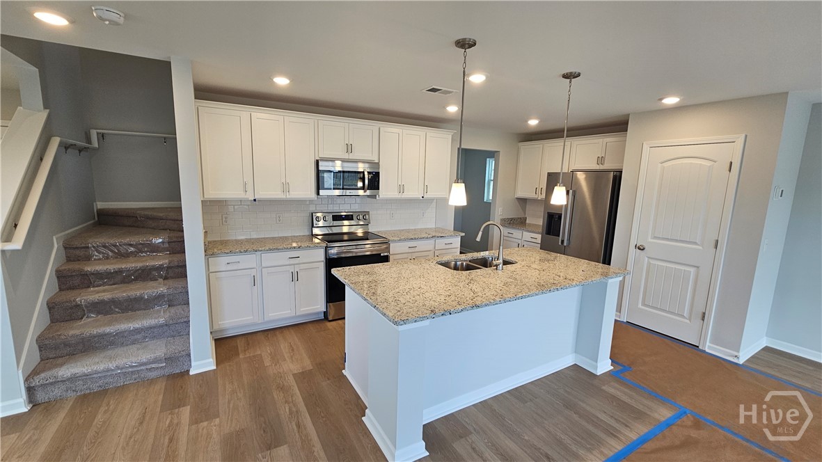 214 Hasty Point Road Savannah, GA 31407 - Photo 4 of 27 Kitchen and Stairs