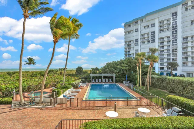 a view of a swimming pool with a patio
