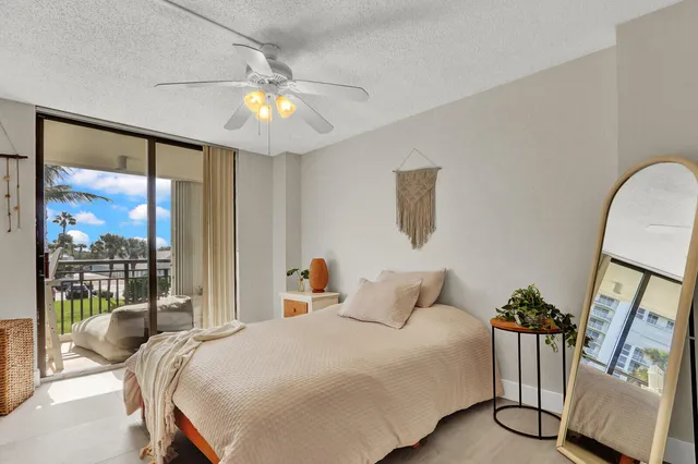 a bed room with a bed and a chandelier