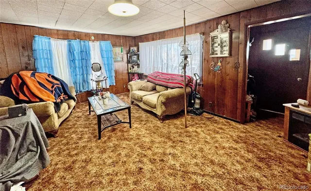 a bed room with a bed and a chair