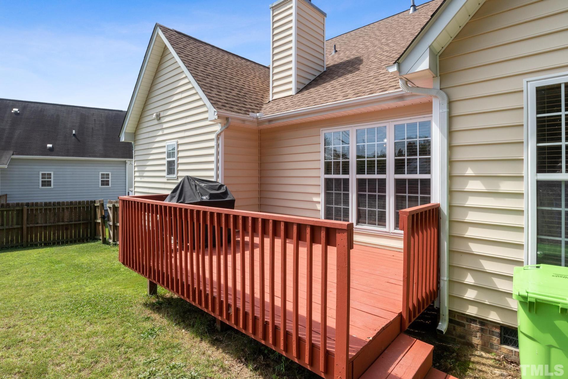 4213 Somerset Valley Lane Raleigh, NC 27616 - Photo 14 of 31 a view of a brick house with a yard and a large window