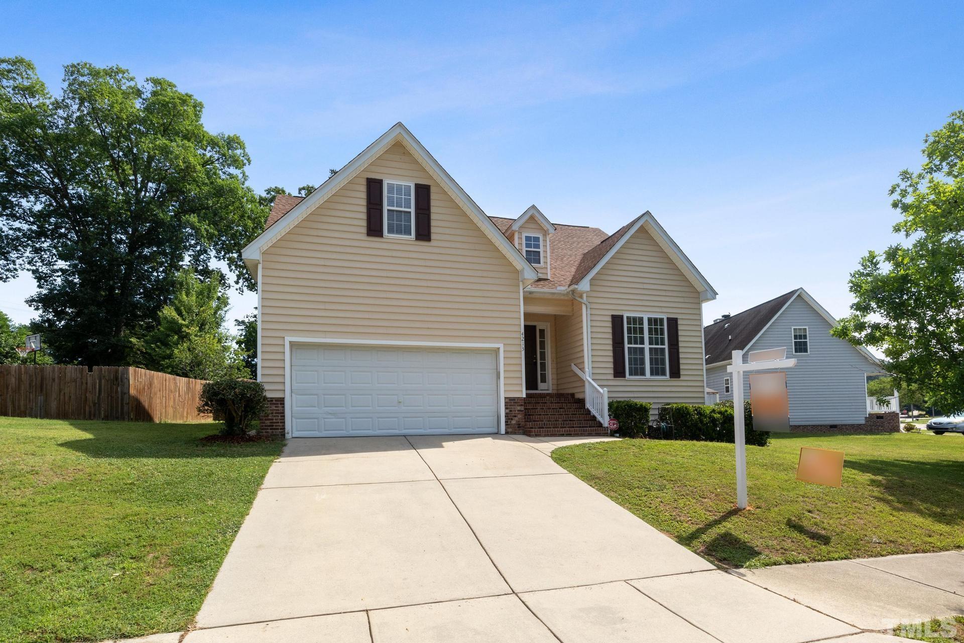 4213 Somerset Valley Lane Raleigh, NC 27616 - Photo 16 of 31 a front view of house with yard and green space