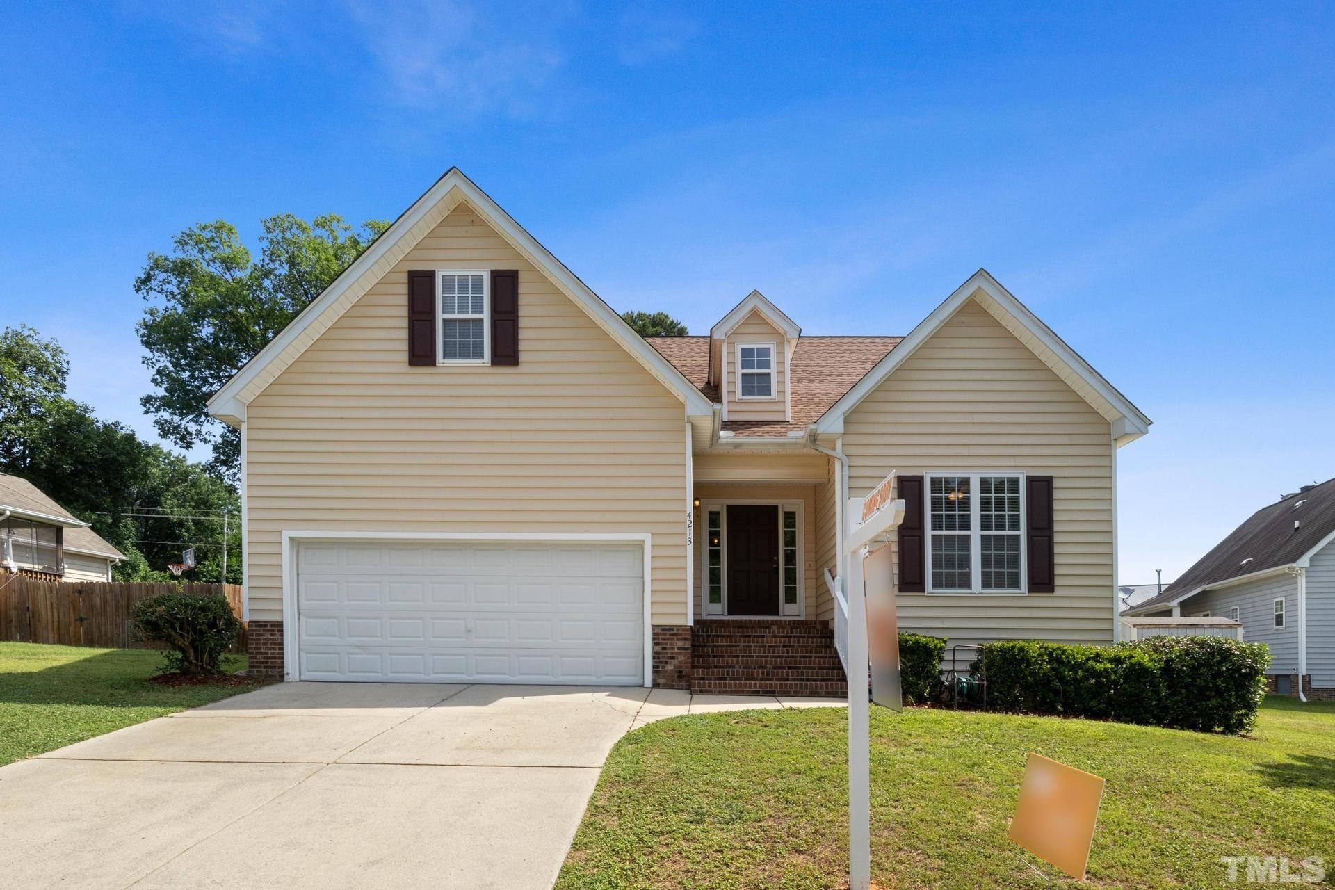 4213 Somerset Valley Lane Raleigh, NC 27616 - Photo 17 of 31 a front view of a house with a yard