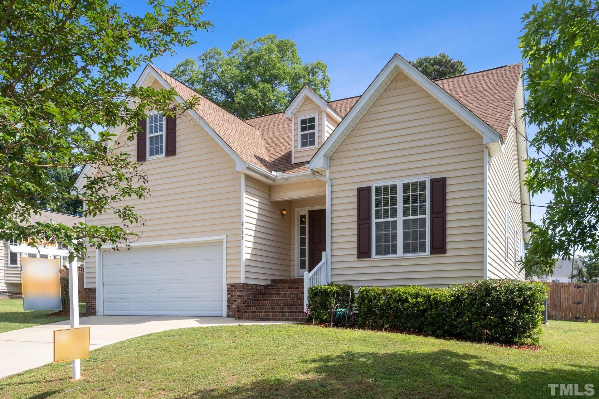 4213 Somerset Valley Lane Raleigh, NC 27616 - Photo 18 of 31 a view of a house with brick walls and a yard with plants