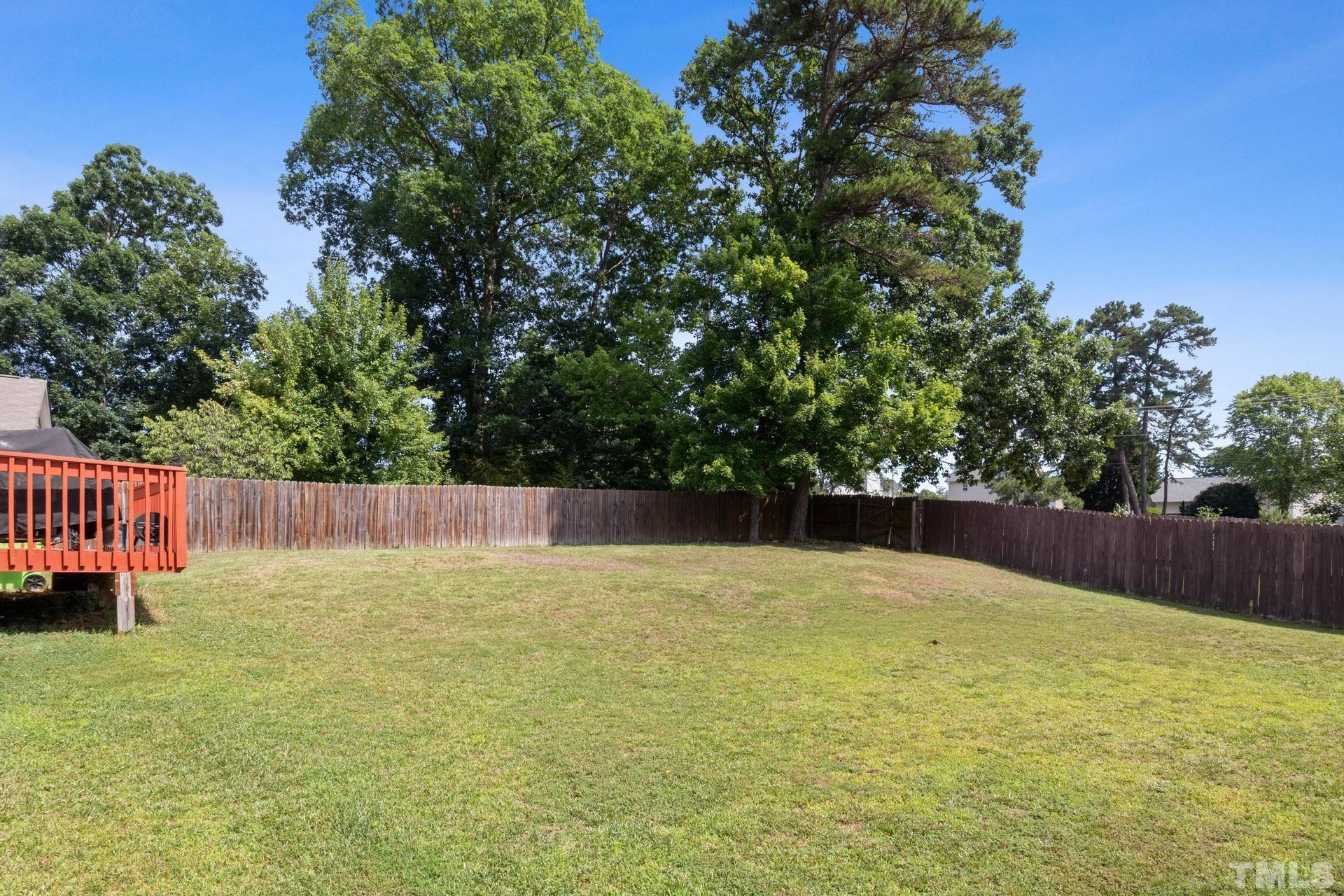4213 Somerset Valley Lane Raleigh, NC 27616 - Photo 19 of 31 a swimming pool with trees in the background
