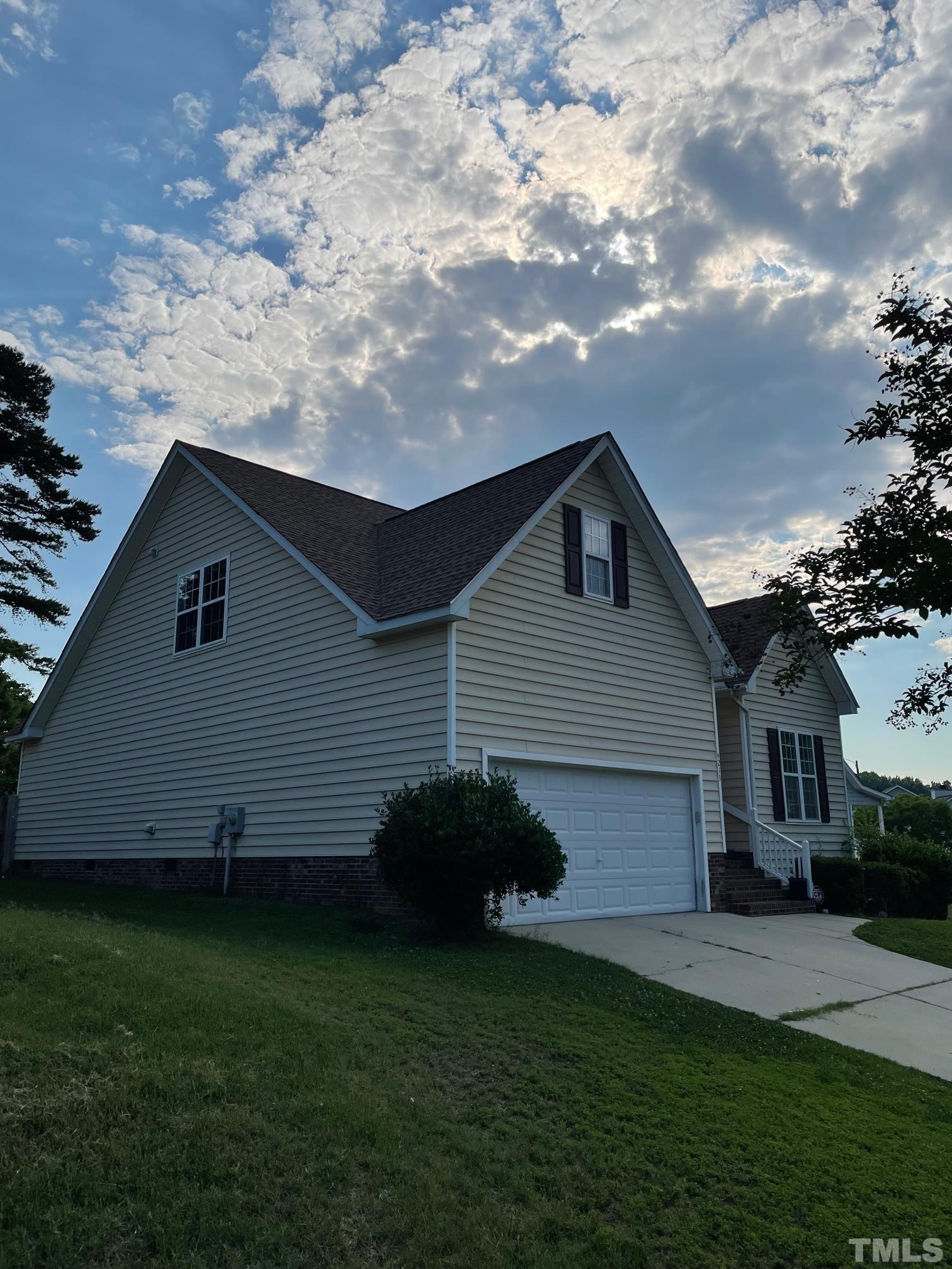 4213 Somerset Valley Lane Raleigh, NC 27616 - Photo 2 of 31 a house view with a garden space