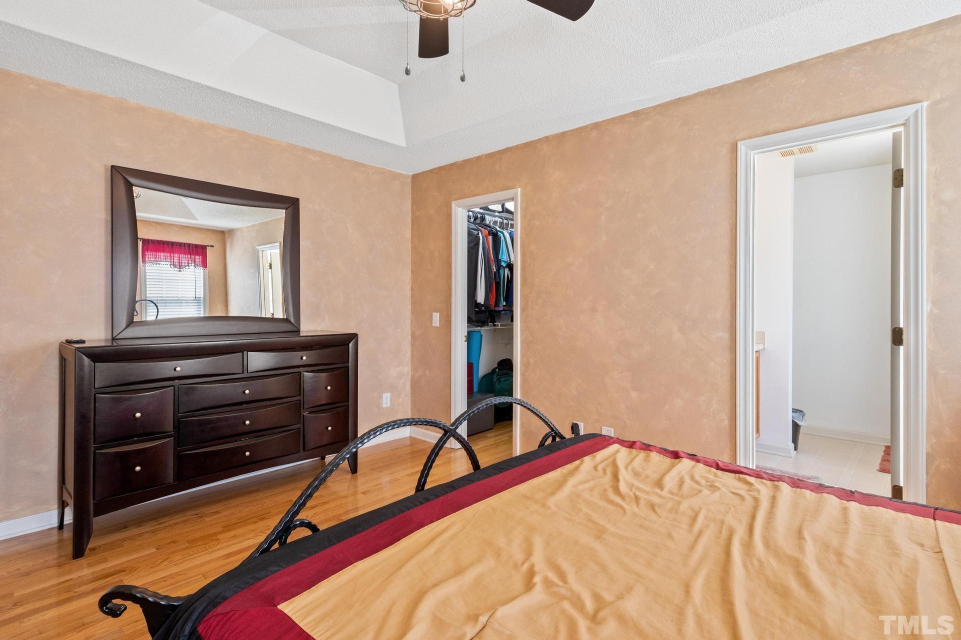 4213 Somerset Valley Lane Raleigh, NC 27616 - Photo 22 of 31 a room with a bed and a dresser