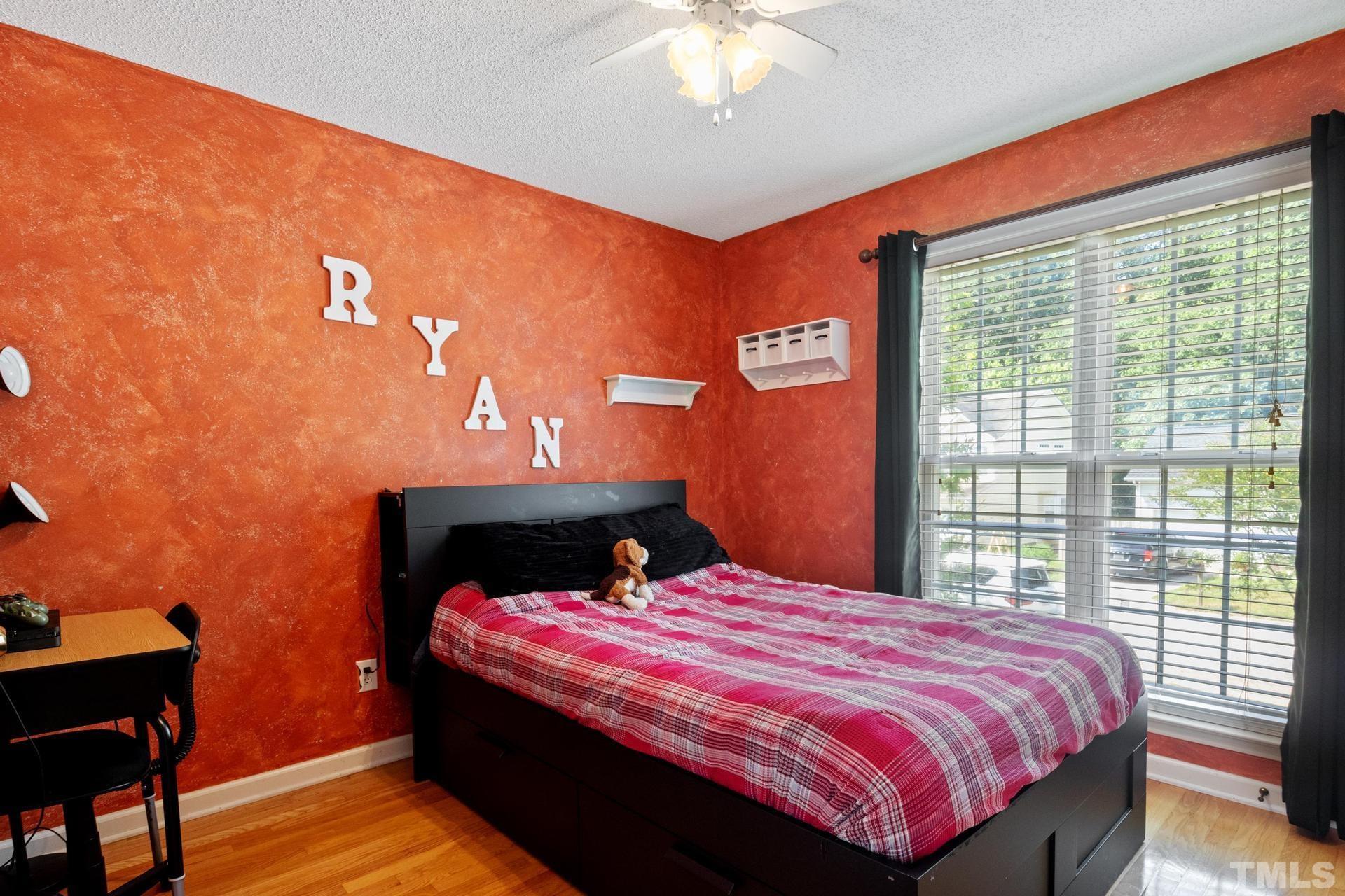 4213 Somerset Valley Lane Raleigh, NC 27616 - Photo 24 of 31 a bedroom with a bed and a window