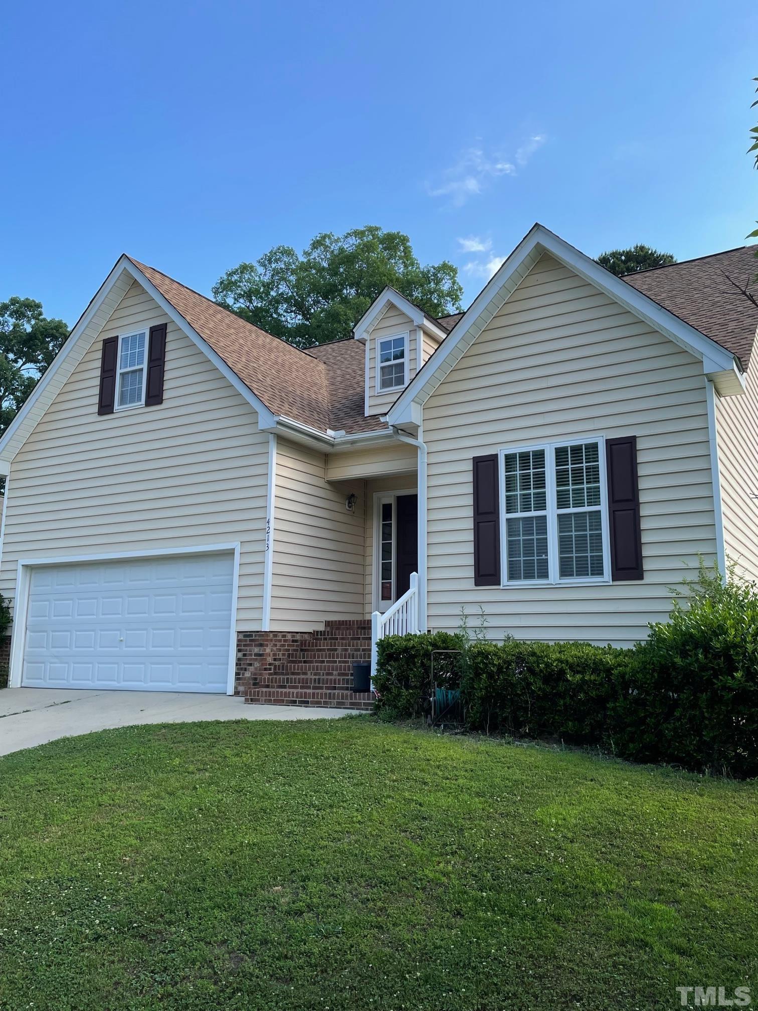 4213 Somerset Valley Lane Raleigh, NC 27616 - Photo 3 of 31 a view of a house with backyard and garden
