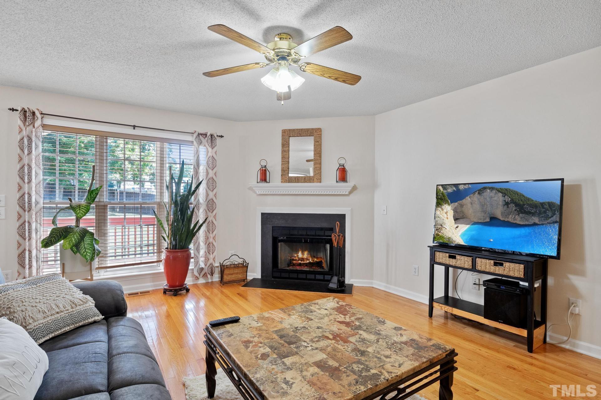 4213 Somerset Valley Lane Raleigh, NC 27616 - Photo 31 of 31 a living room with furniture fireplace and window