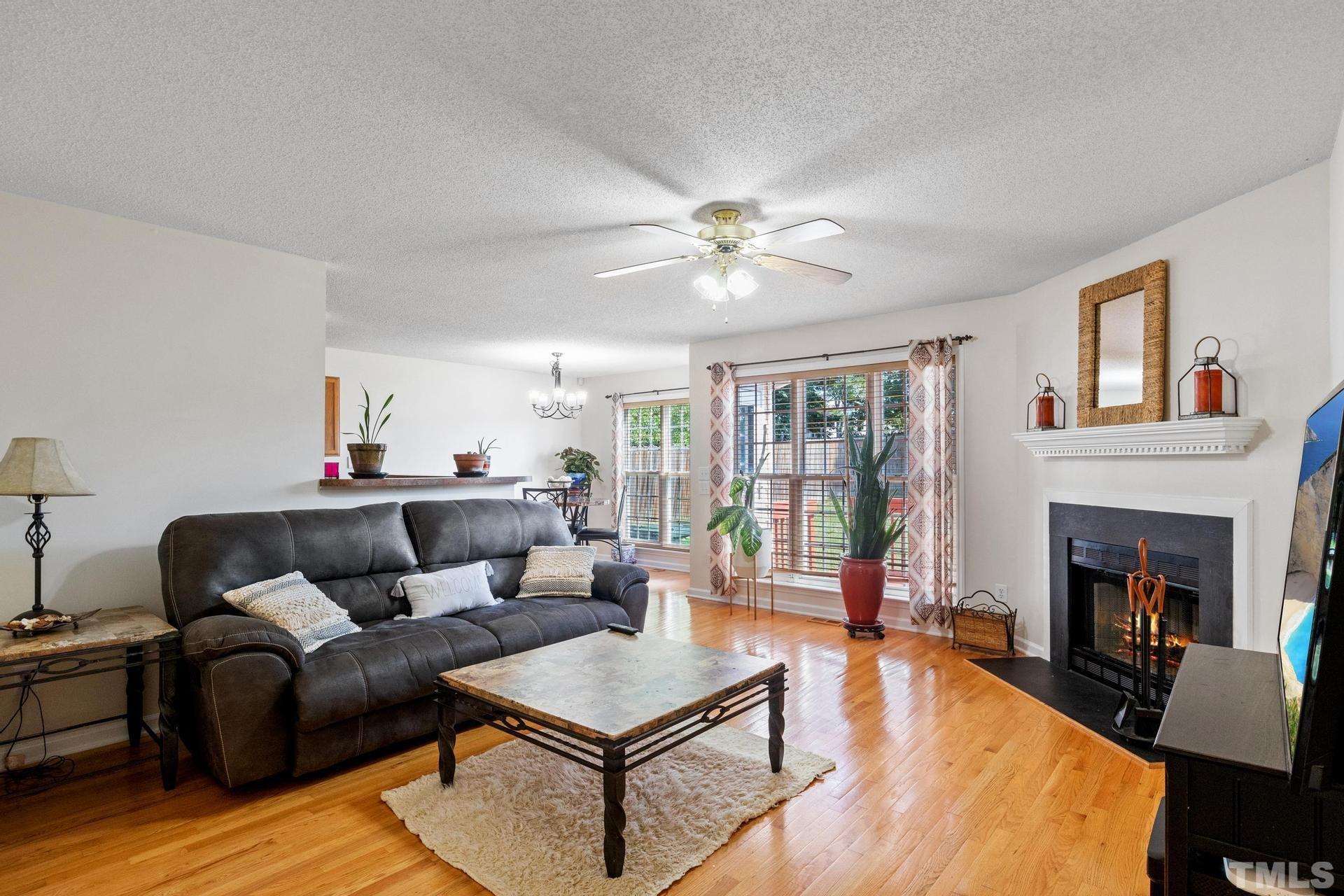 4213 Somerset Valley Lane Raleigh, NC 27616 - Photo 10 of 31 a living room with furniture and a fireplace
