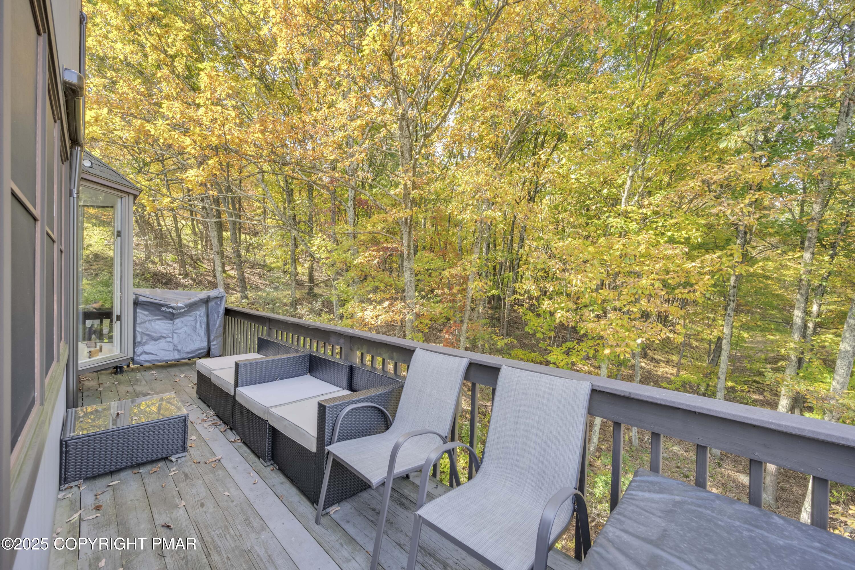 147 Cross Country Lane Tannersville, PA 18372 - Photo 13 of 39 a balcony with wooden floor and outdoor seating