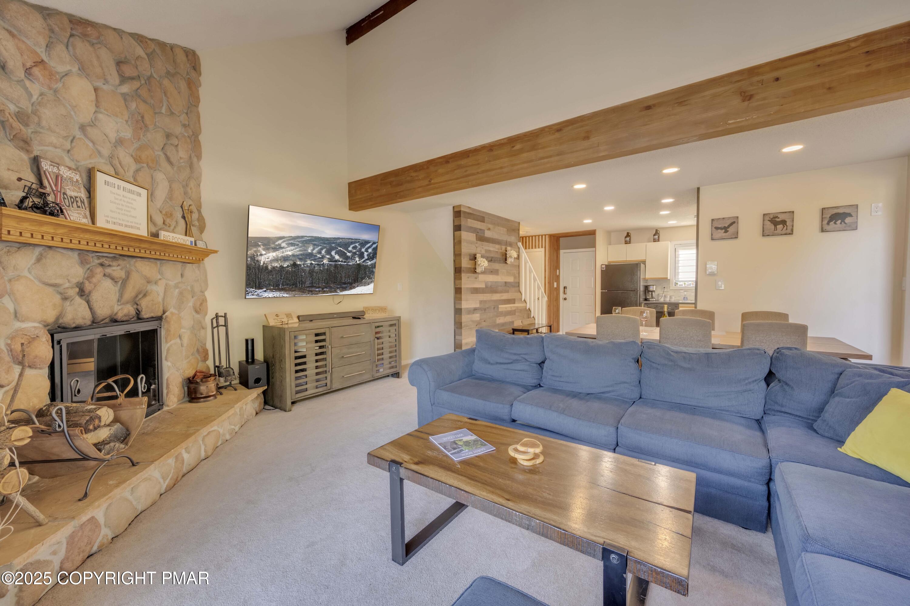 147 Cross Country Lane Tannersville, PA 18372 - Photo 17 of 39 a living room with furniture and a fireplace