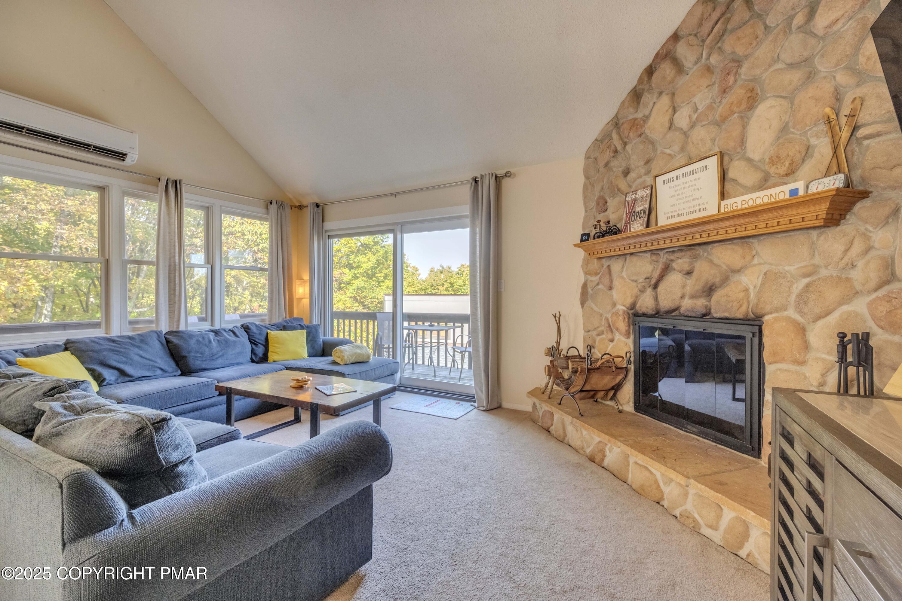 147 Cross Country Lane Tannersville, PA 18372 - Photo 18 of 39 a living room with furniture and a fireplace