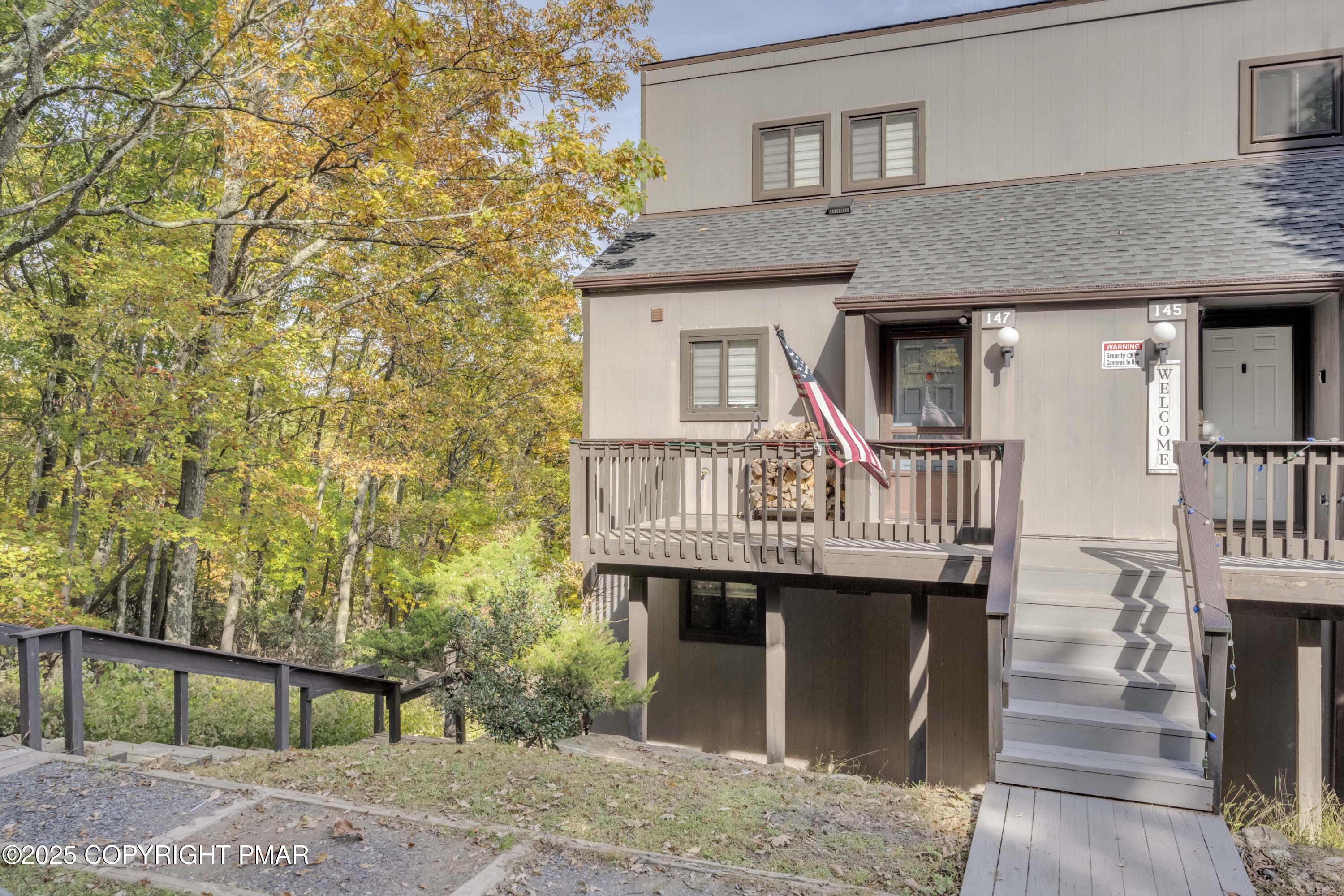 147 Cross Country Lane Tannersville, PA 18372 - Photo 2 of 39 a front view of a house with a fountain