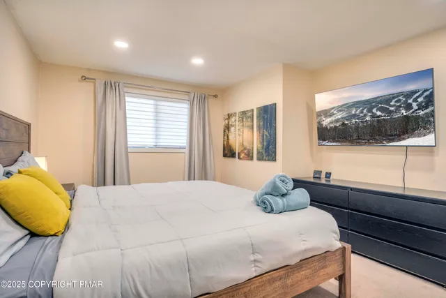 a bedroom with a bed and window