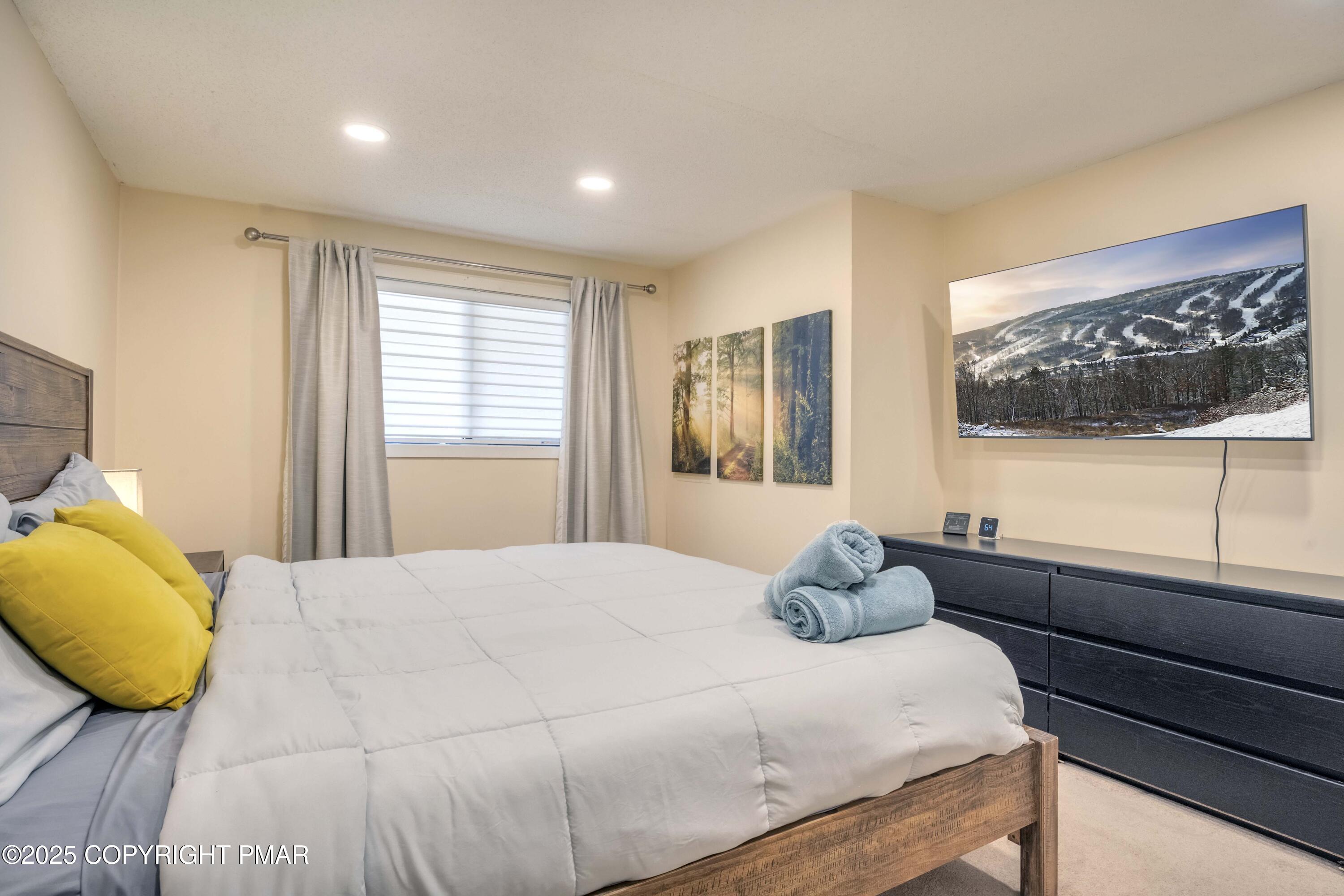 147 Cross Country Lane Tannersville, PA 18372 - Photo 22 of 39 a bedroom with a bed and window