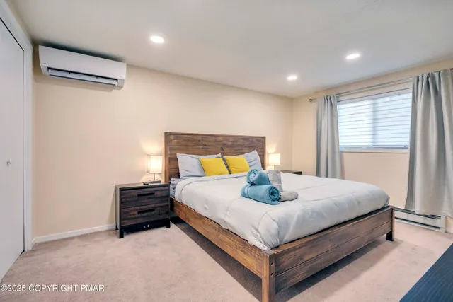 a bedroom with a bed and window