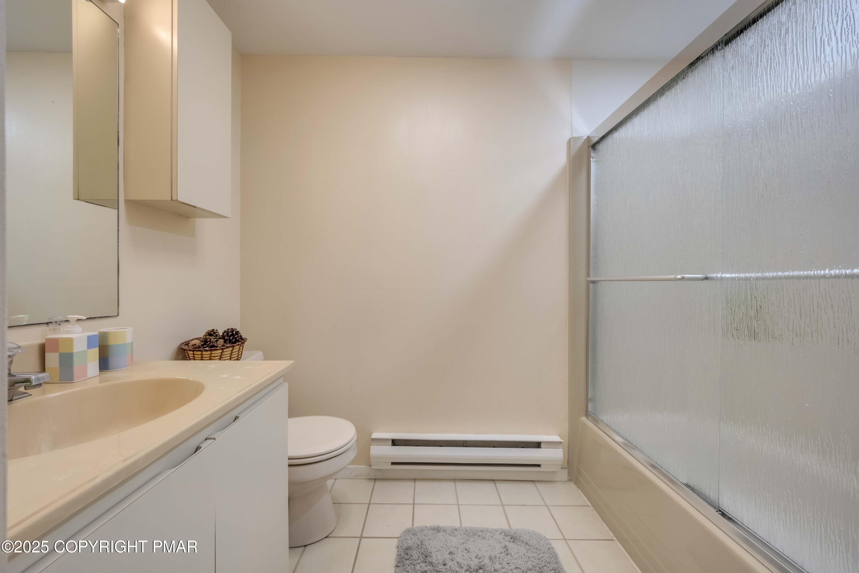 147 Cross Country Lane Tannersville, PA 18372 - Photo 25 of 39 a bathroom with a sink a toilet and shower