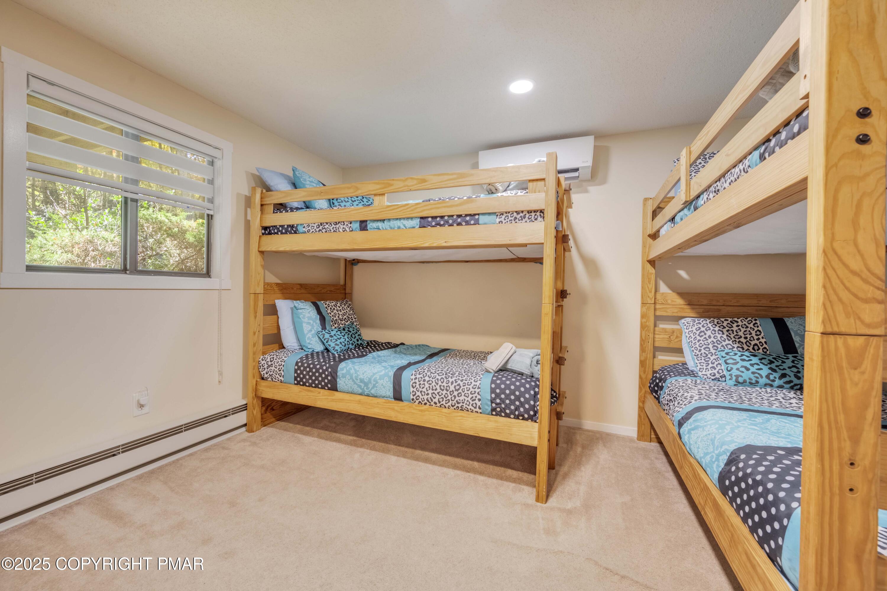147 Cross Country Lane Tannersville, PA 18372 - Photo 27 of 39 a bedroom with furniture and a bathtub